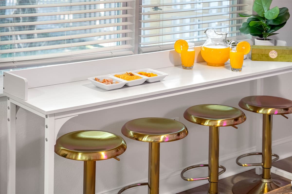 This cozy dining spot, nestled in a corner of your home, exudes warmth and elegance, creating an inviting atmosphere for any meal, from breakfast to dinner.
