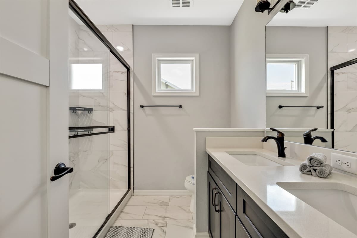 Whether you prefer a refreshing morning shower or a relaxing evening bath, the ensuite provides the perfect space to unwind.