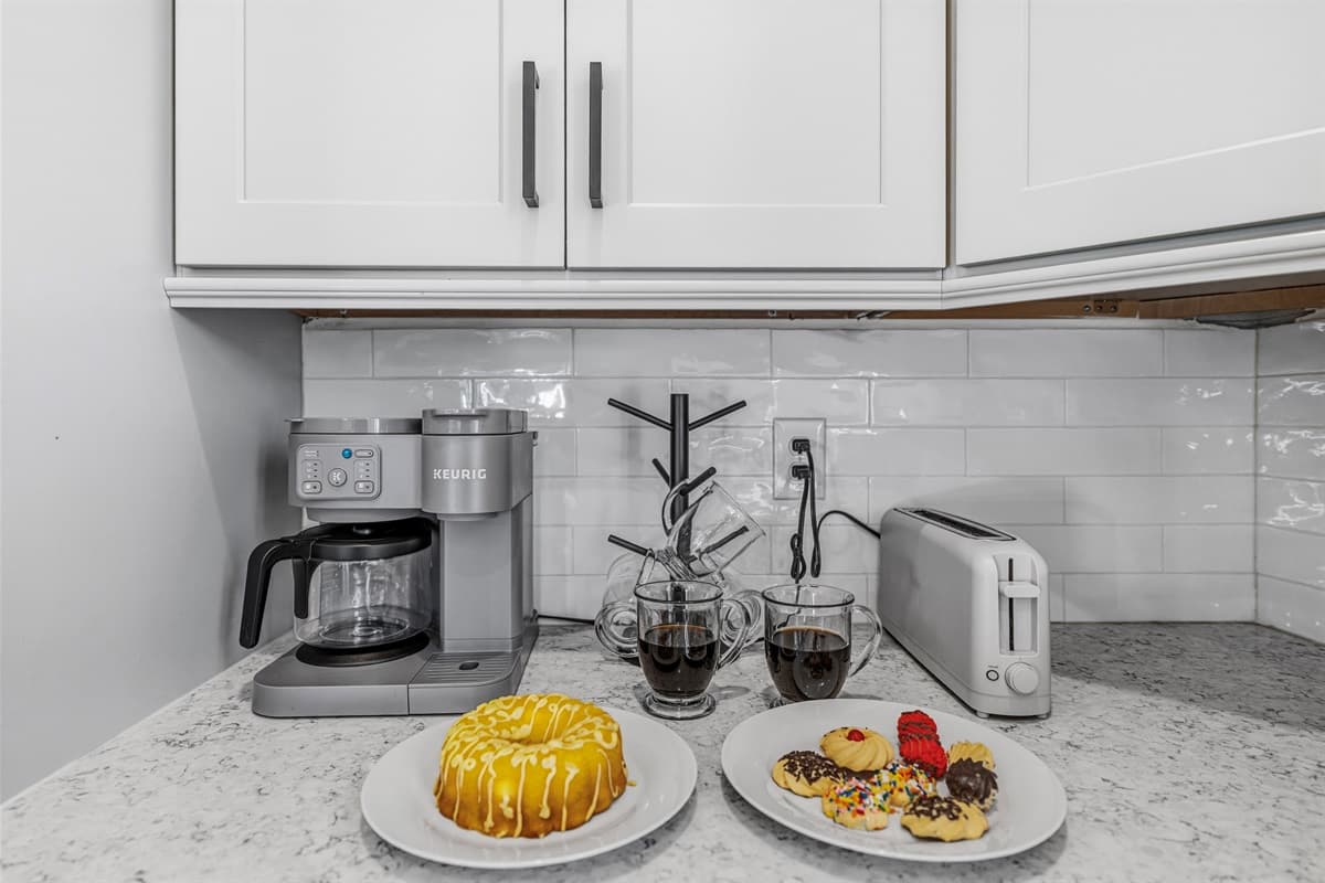 Wake up to a fully stocked kitchen! The counter is ready with a coffee maker, toaster, and all the essentials — plus there's plenty of counter space in this brand-new Seminole Heights home to make yourself right at home.