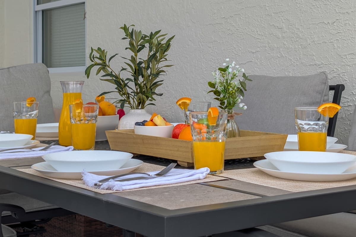 Dine, relax, and unwind by the pool. This covered patio offers a stylish dining area with cushioned seating and refreshing ambiance — ideal for meals, cocktails, or quiet relaxation.