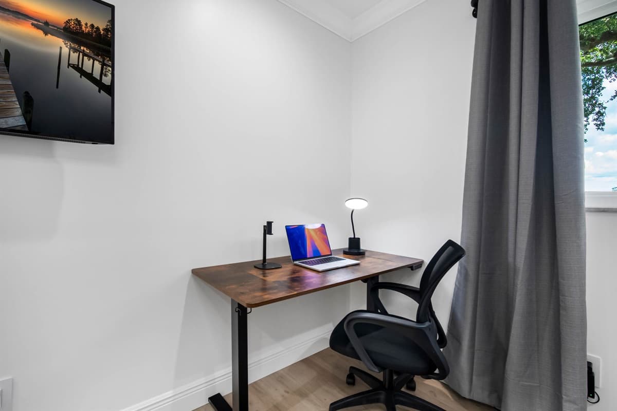 A dedicated workstation with an ergonomic chair makes this room perfect for digital nomads or remote professionals.