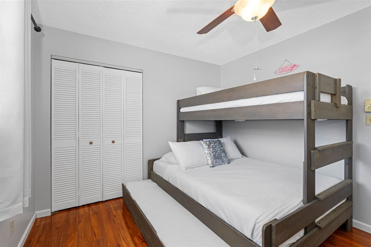 Relax in this thoughtfully furnished room featuring a bunk bed, modern furniture, and everything you need to feel right at home.
