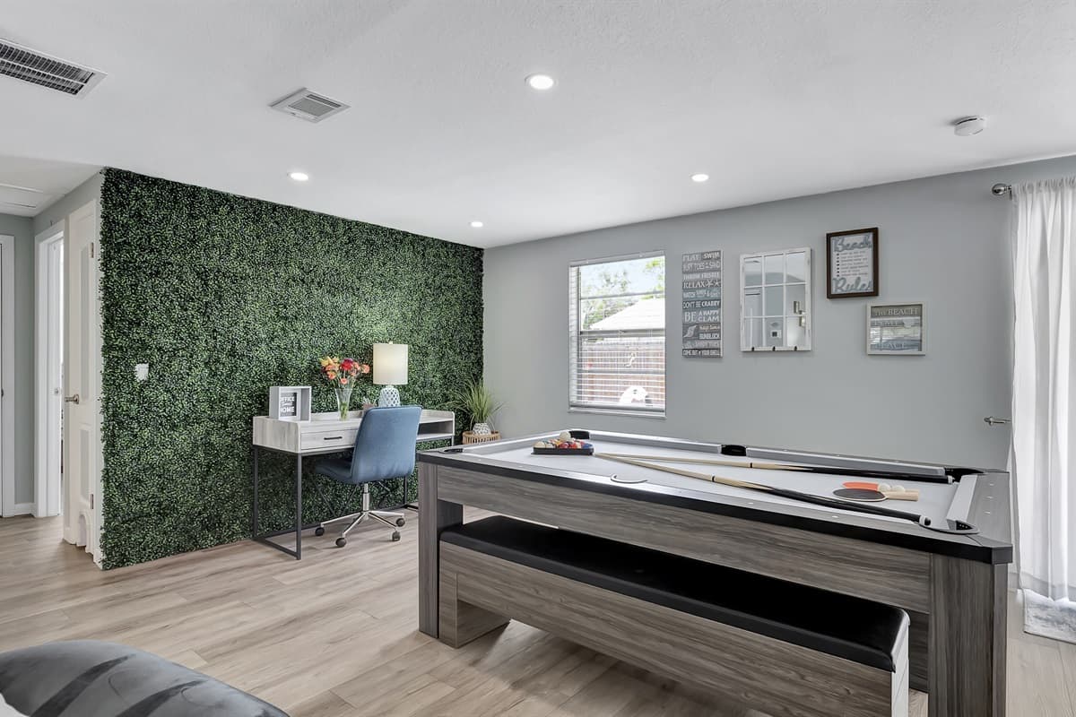 The dining table for 8 can magically transform into a thrilling pool table or a lively ping pong table.