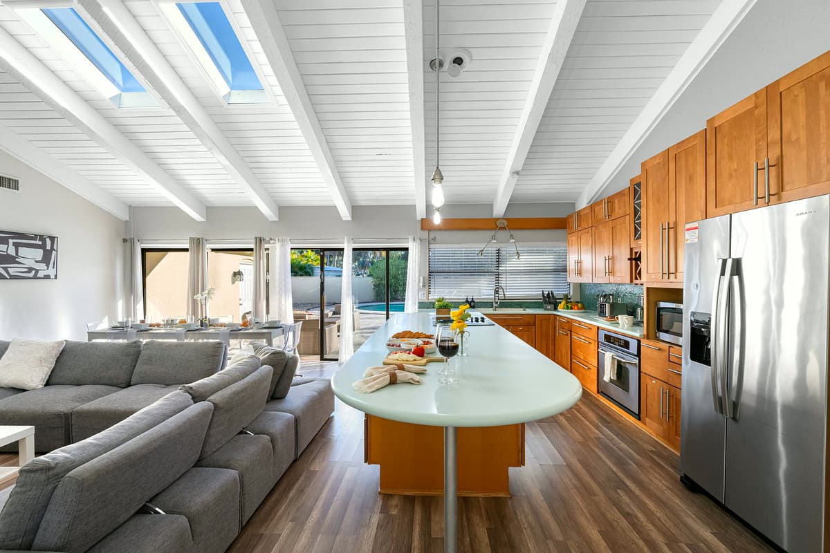 Bright, airy, and beautifully designed — this living area flows effortlessly into the dining and kitchen spaces for easy entertaining.