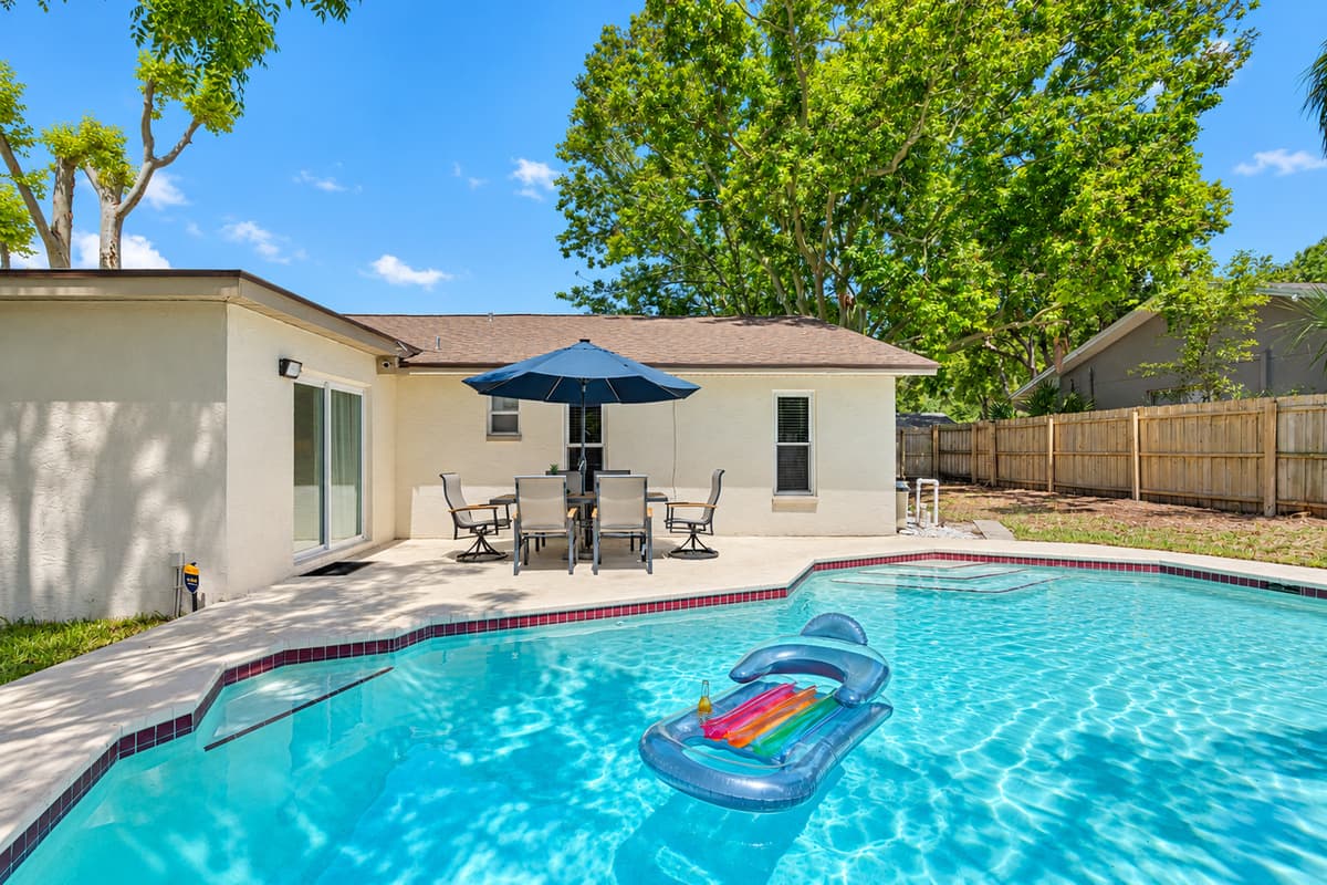 The pool area is thoughtfully designed to accommodate both active and leisurely pursuits, ensuring there's something for everyone.