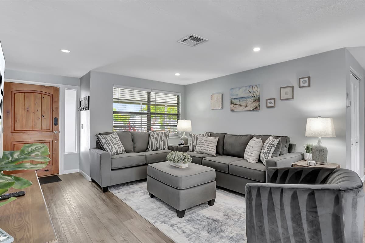 Step into our inviting living room, a spacious haven bathed in abundant natural light.