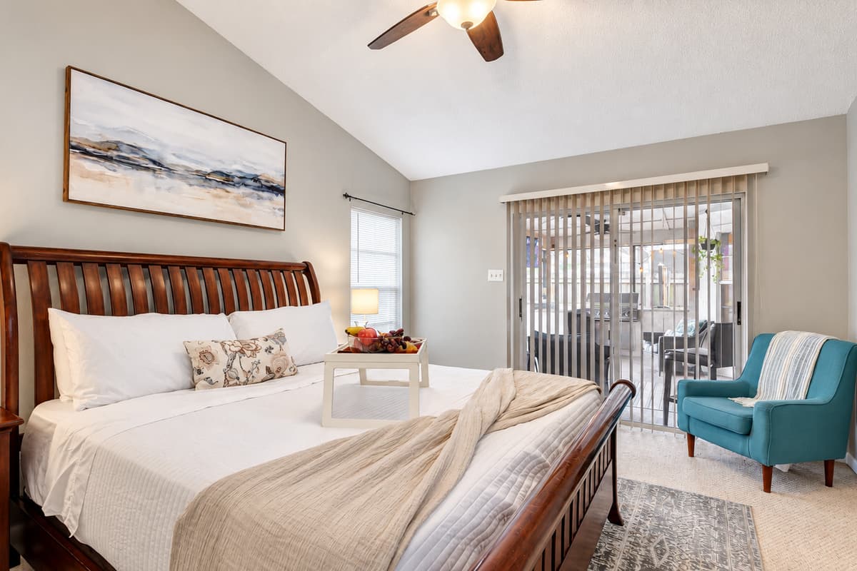 This master bedroom not only boasts a stylish en-suite bathroom but also grants seamless access to the inviting pool area.
