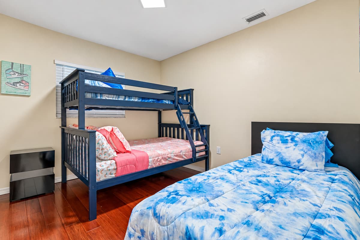 Welcome to this charming and cozy bedroom, perfect for family or friends to share.