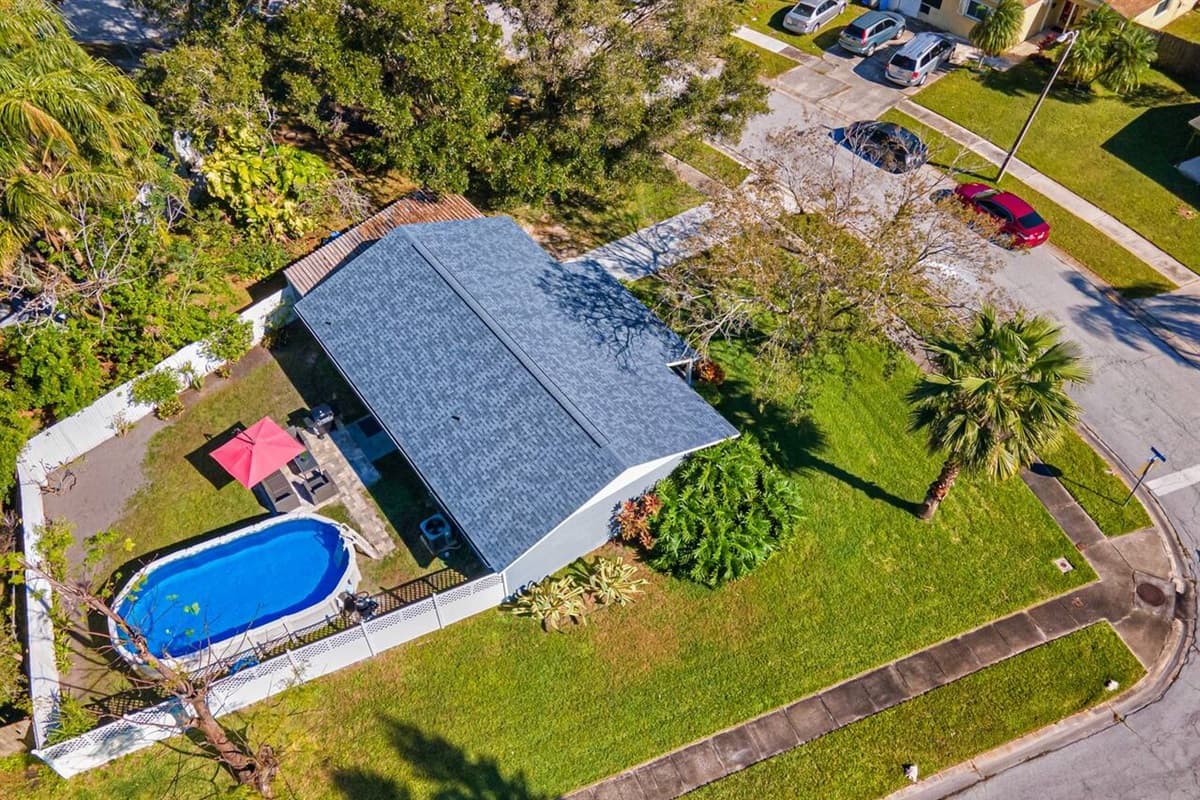 Aerial side view of our amazing property! Worry not about kids playing in the fully fenced backyard during your stay! Inquire about this property now!