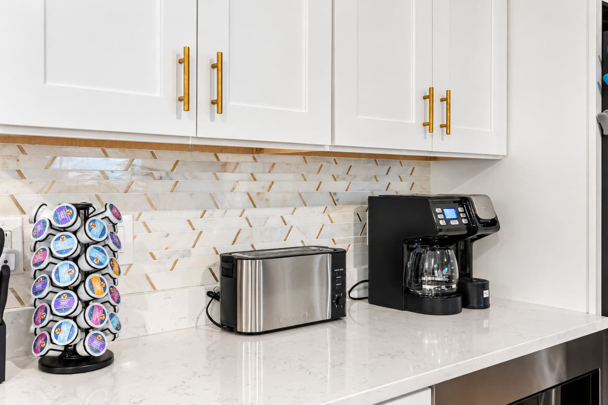 Gleaming countertops and clean lines create an elevated yet welcoming vibe.