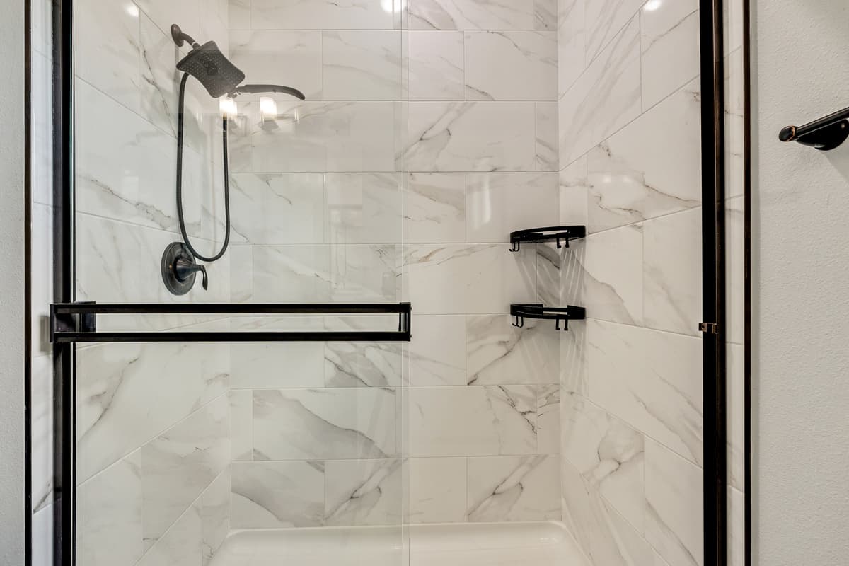 The private ensuite bathroom stands as a testament to exquisite design and seamless functionality.