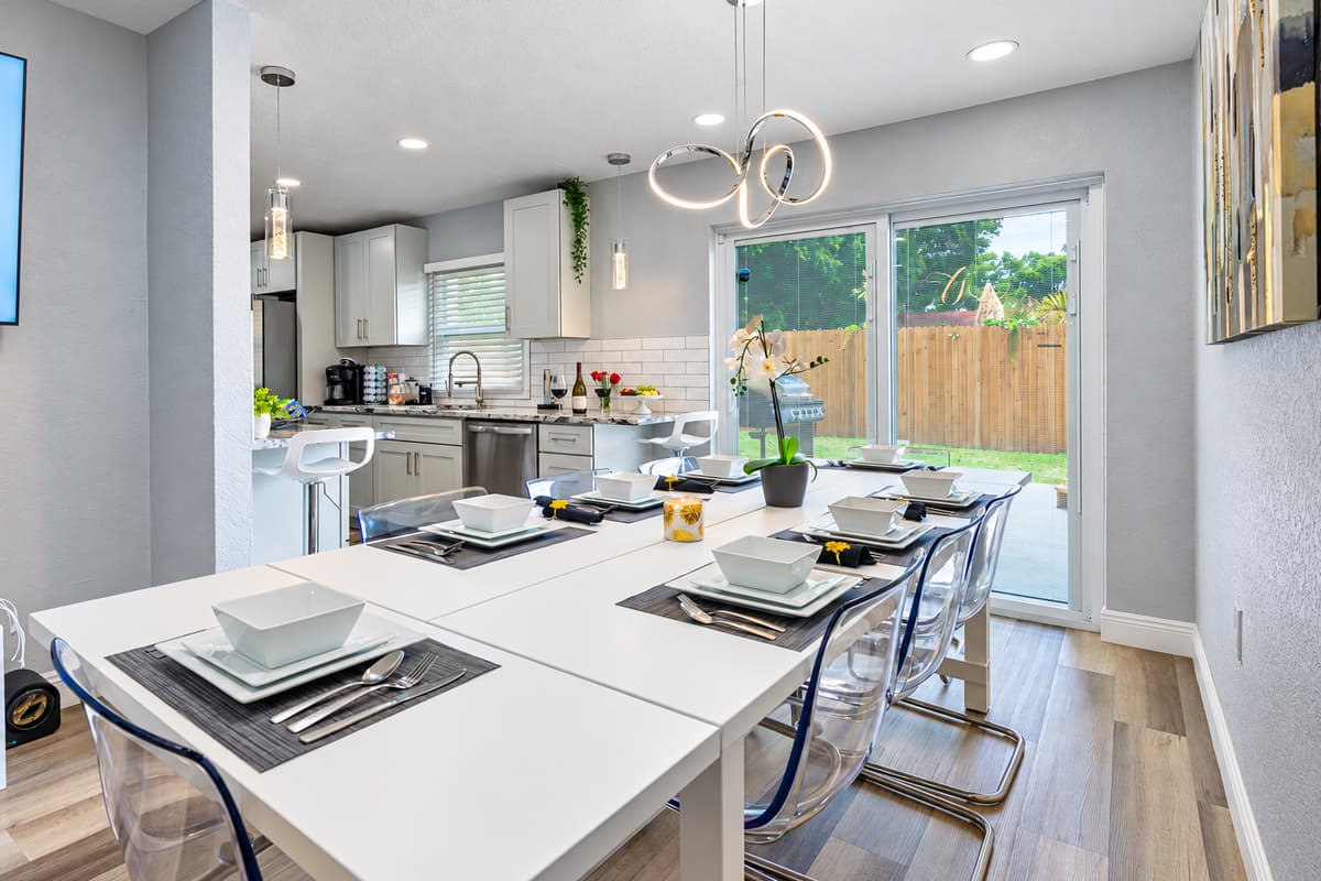 Dine with a view of the pool. Sliding glass doors open from the dining area to the fenced backyard and pool. Watch the kids swim from the table, then step outside for dessert by the water.