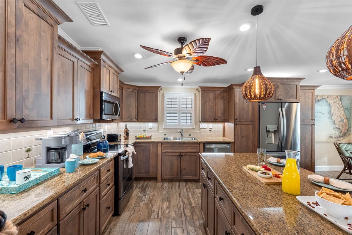 The heart of the home—this kitchen offers a perfect blend of style and functionality with rich wood cabinets and sleek stainless appliances.