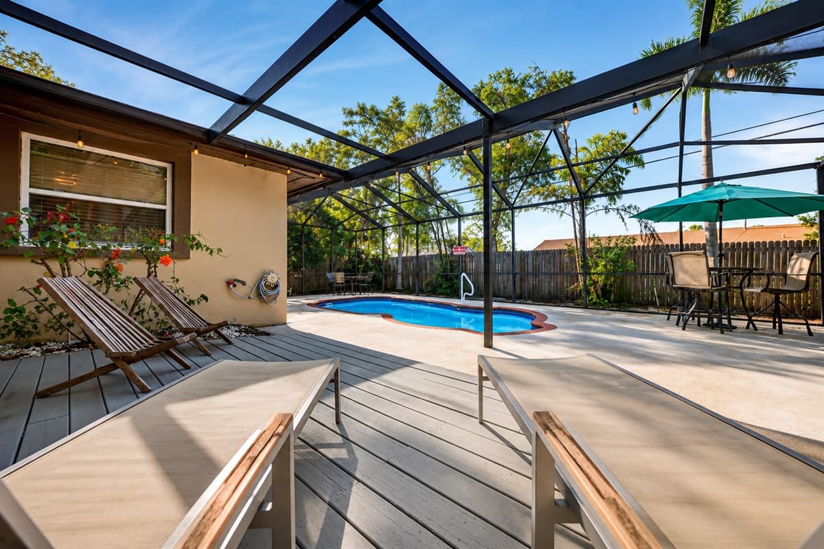 Expansive pool deck with lounge chairs, outdoor dining, and plenty of room to relax and unwind.