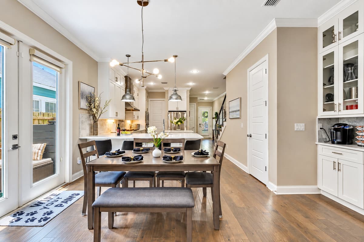 The table’s rich wood grain adds a touch of rustic charm, perfectly complementing the modern aesthetic of the surrounding décor.