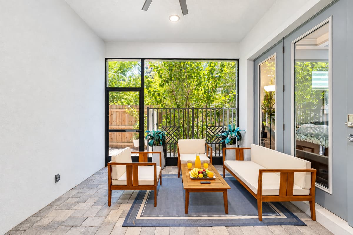 This inviting area offers ample seating options, encouraging you to settle in and savor the serene sights of the outdoors.