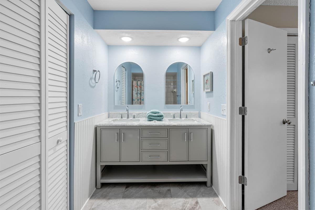 Ensuite bathroom connected to the master bedroom - At the heart of the ensuite, you’ll find a stunning his-and-hers sink vanity, offering ample counter space and storage.