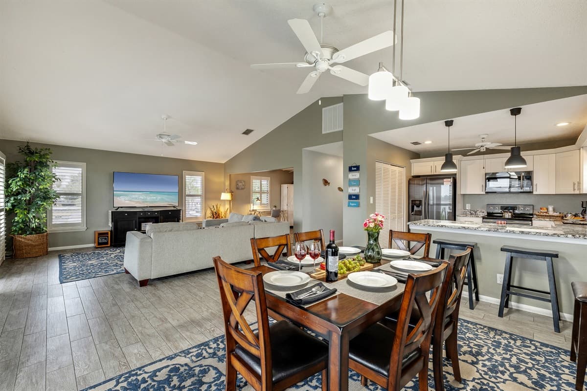 The dining area is conveniently located in close proximity to the kitchen, allowing for easy access and seamless interaction between cooking and dining.