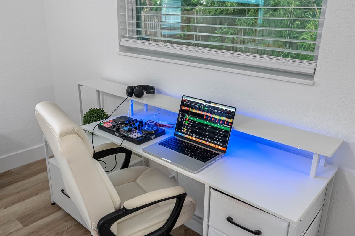 Whether you're here to unwind or work remotely, this bedroom is equipped with a full desk setup, modern lighting, and a restful bed for total versatility.