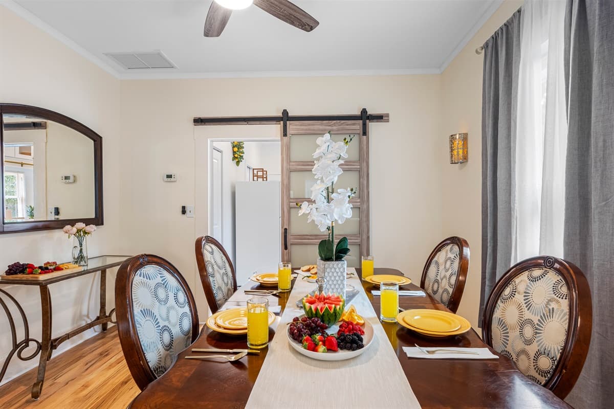Featuring a beautiful 4-seater solid wood dining table, this area combines both style and functionality.