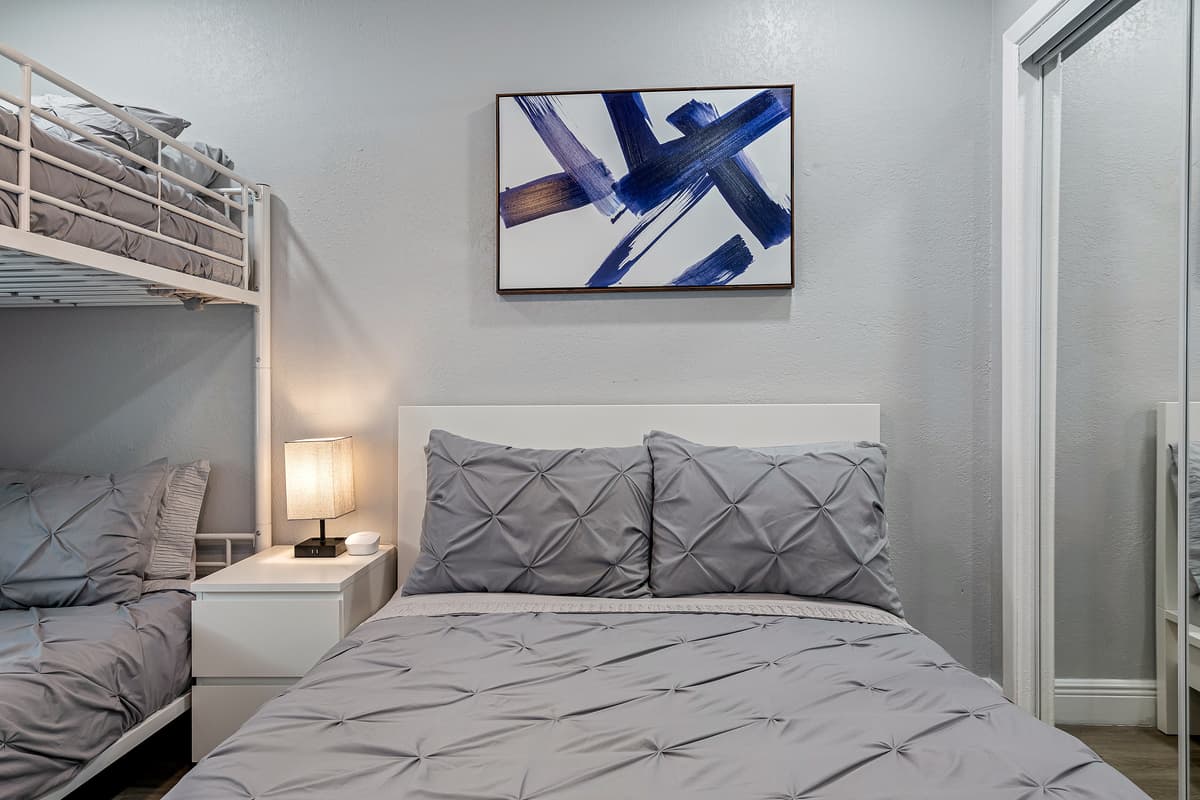 Our wonderful bedroom with a comfortable huge bed, a bunk bed and its own smart TV. Feel at home in your home away from home. If you think you'd enjoy your trip to this property, send us a message now!