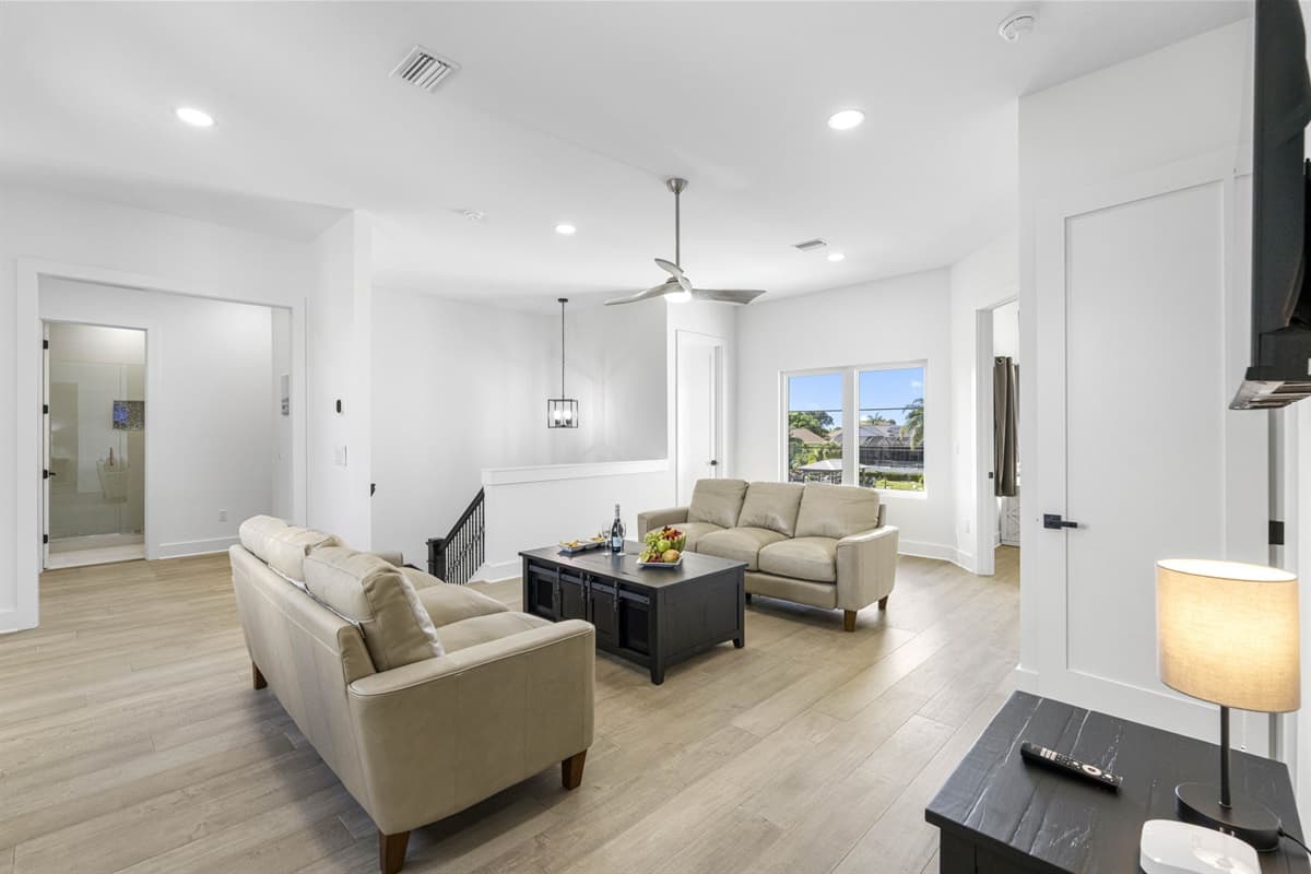 The second living area provides a more intimate setting, perfect for quiet conversations, reading, or unwinding with a good book.