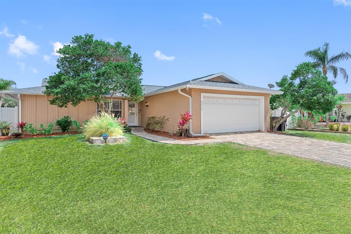 The exterior of the home is adorned with lush landscaping.