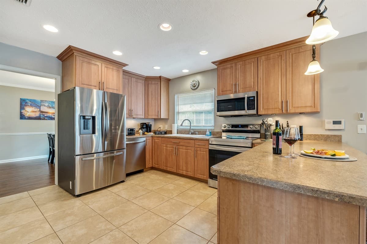 At the heart of this kitchen lies a mesmerizing display of cutting-edge appliances, meticulously curated to elevate your cooking experience to new heights.