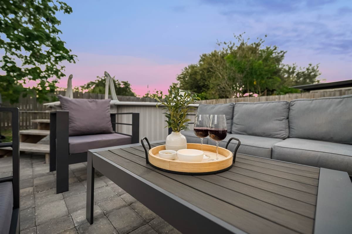 Relax under the shade of mature trees and enjoy this peaceful backyard retreat.