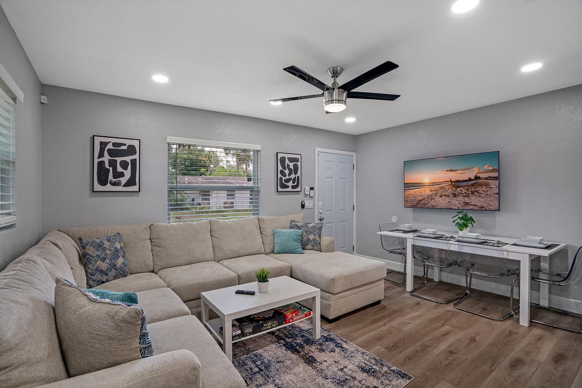 Experience modern comfort in the spacious living room, featuring a large smart flat-screen TV—perfect for streaming your favorite shows and movies.