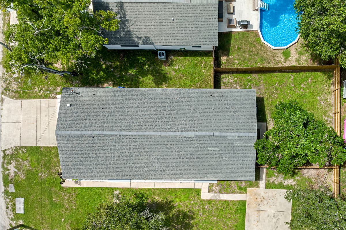 Top view of our beatiful property showcasing the stunning heated pool and lounge area at the back of the property. Love what you see? Ask us questions and send us an inquiry as soon as possible!