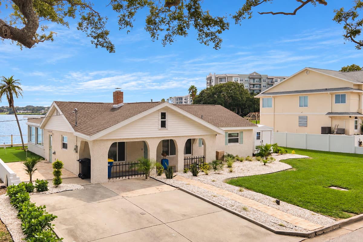 Easy parking and classic curb appeal. A wide driveway, arched front porch and tidy landscaping. Pull in, unload and step straight into your waterfront getaway.