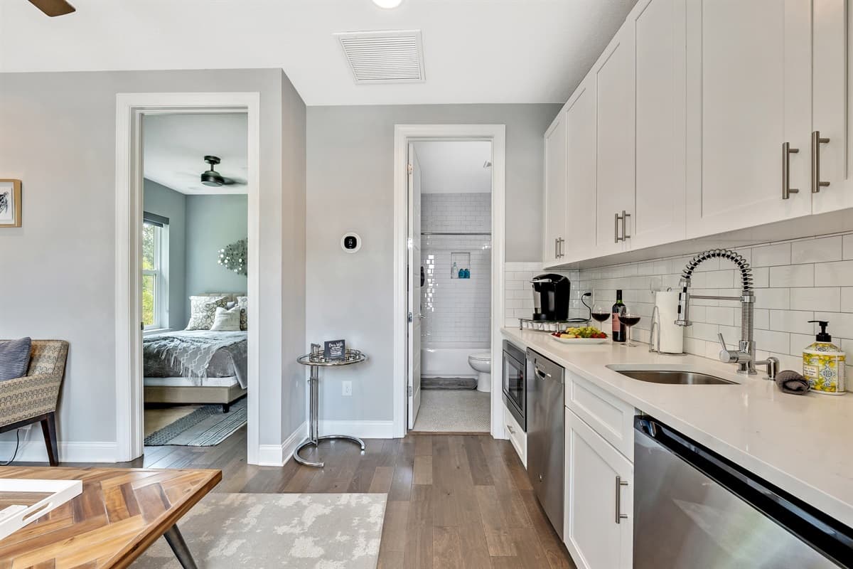 The open-concept layout seamlessly connects the second Living Room with the adjacent kitchen