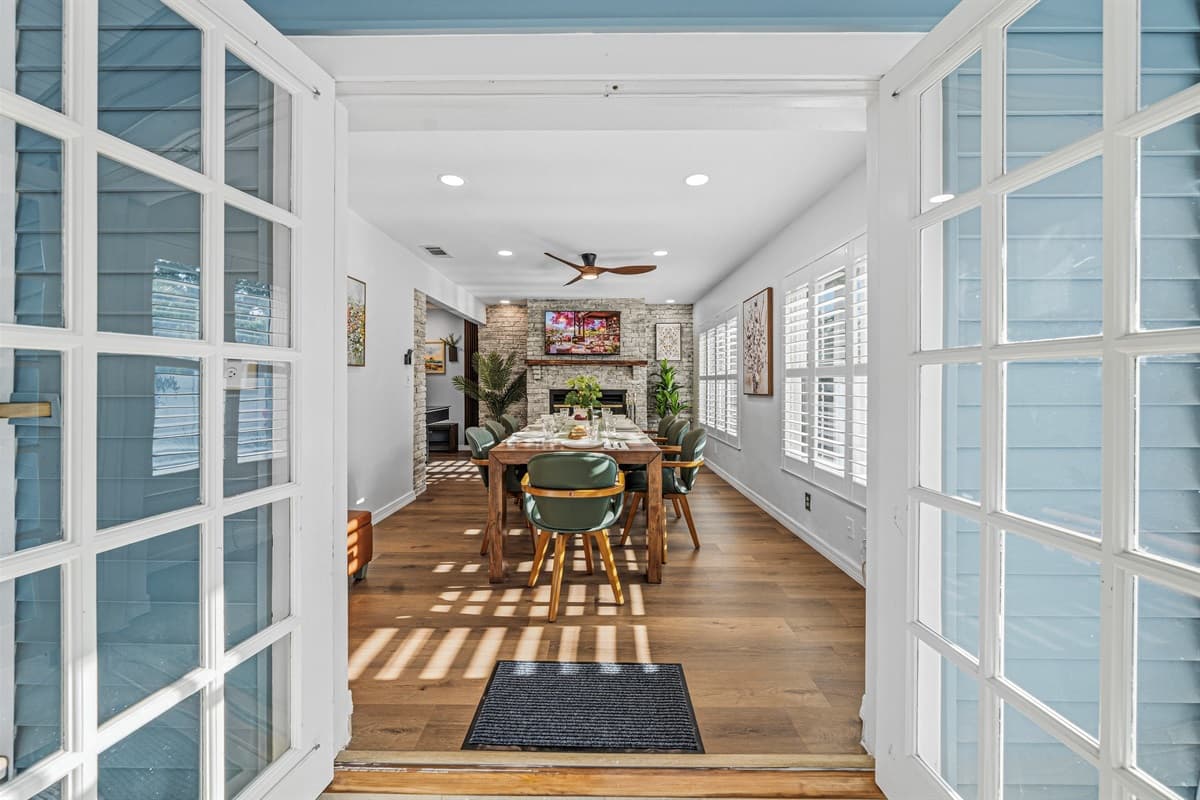 Welcoming entryway with French doors leading into the dining and living areas—bright and inviting 