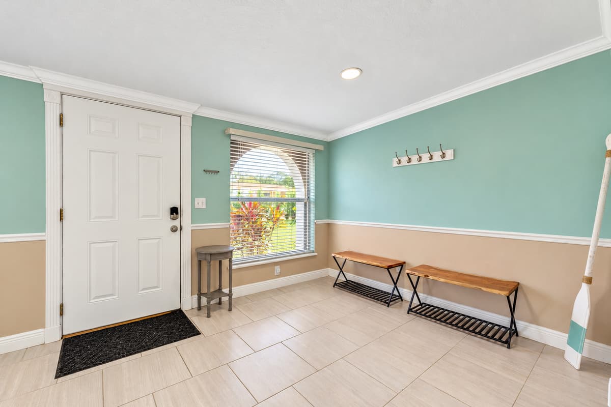 Discover an additional seating area just beyond the front door, creating a welcoming space that sets the tone for your entire stay.