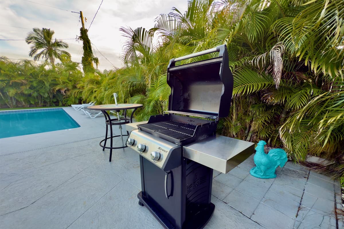A full-size gas grill and seating area make this backyard the perfect spot for BBQ nights.