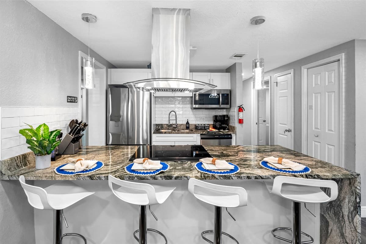 Enjoy morning coffee or evening wine at the large breakfast bar designed for comfort and conversation.
