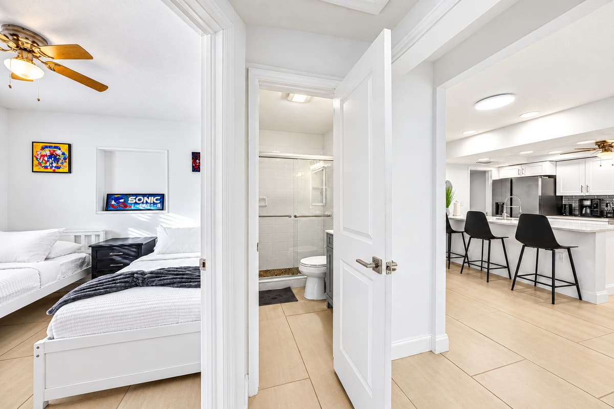 Bedroom entrance view showcasing easy access to the bathroom and open-concept living area.