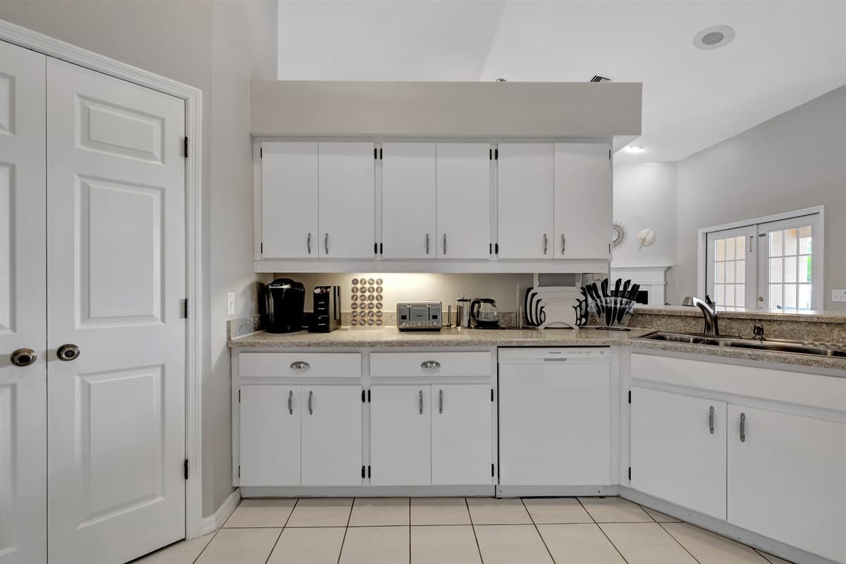 Welcome to our stunning kitchen. The meticulously crafted wooden cupboards provide ample storage space, combining practicality with aesthetic appeal.