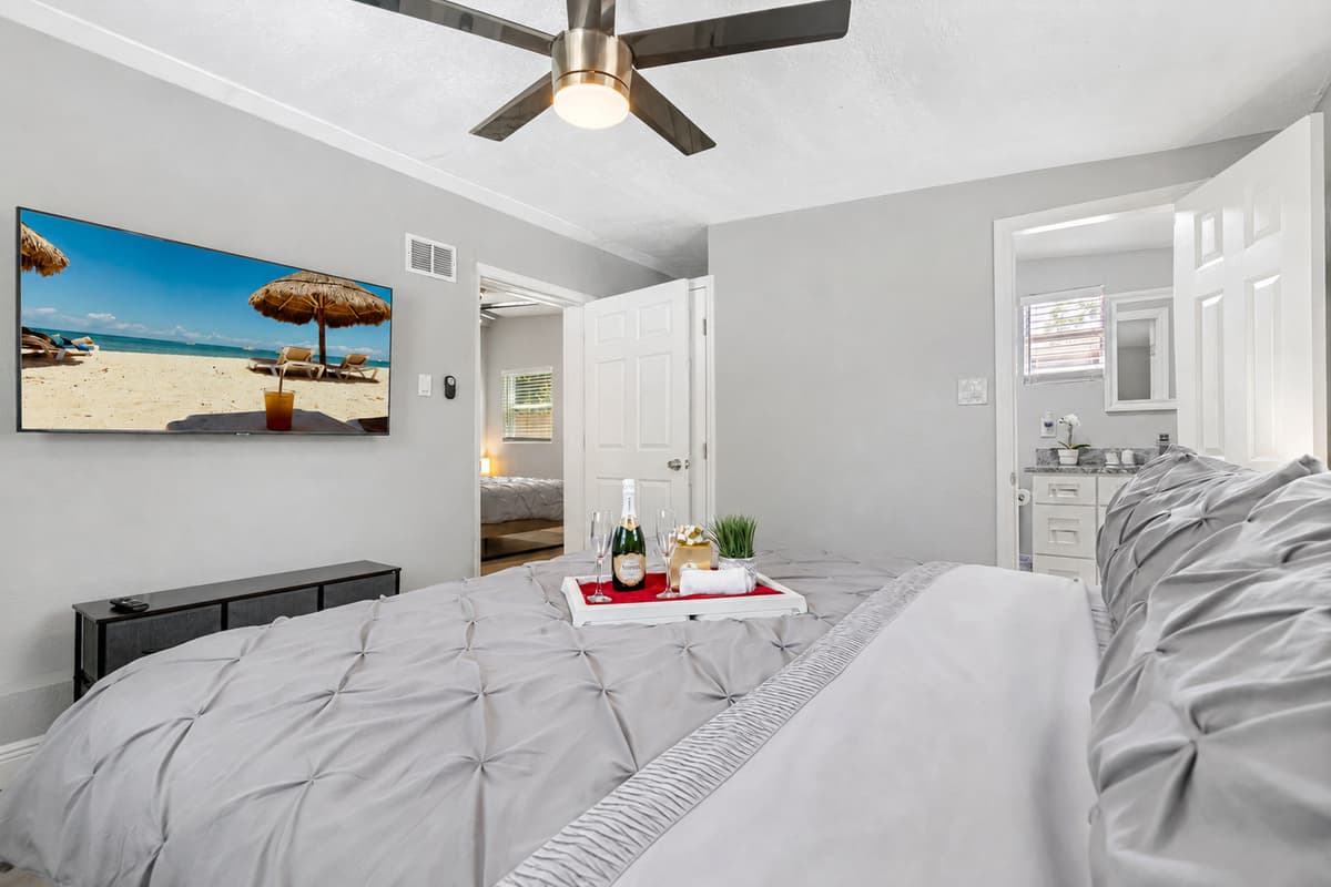 As you enter, you'll be drawn to the plush king size bed, which takes center stage in the room.
