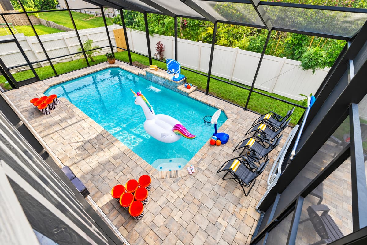 No need to worry about bugs or debris—this screened pool is perfect for long, uninterrupted days of splashing, lounging, and relaxing.