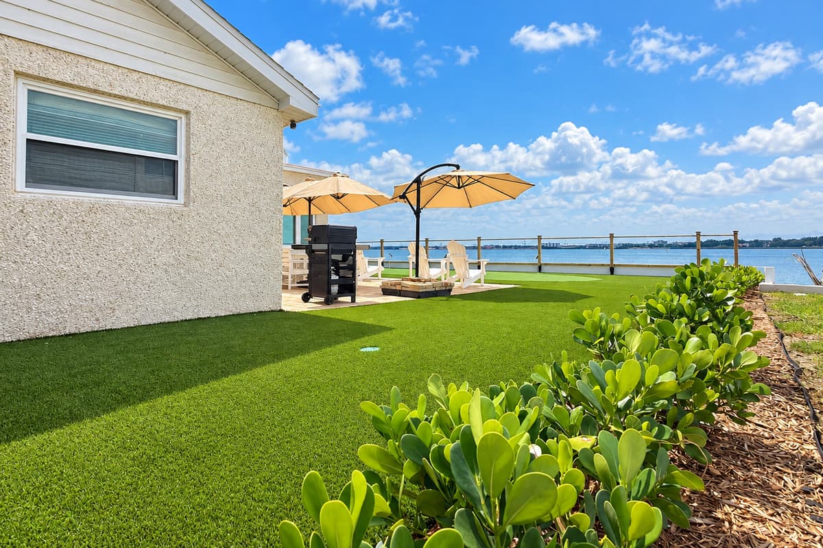 Waterfront patio with outdoor dining and places to relax.