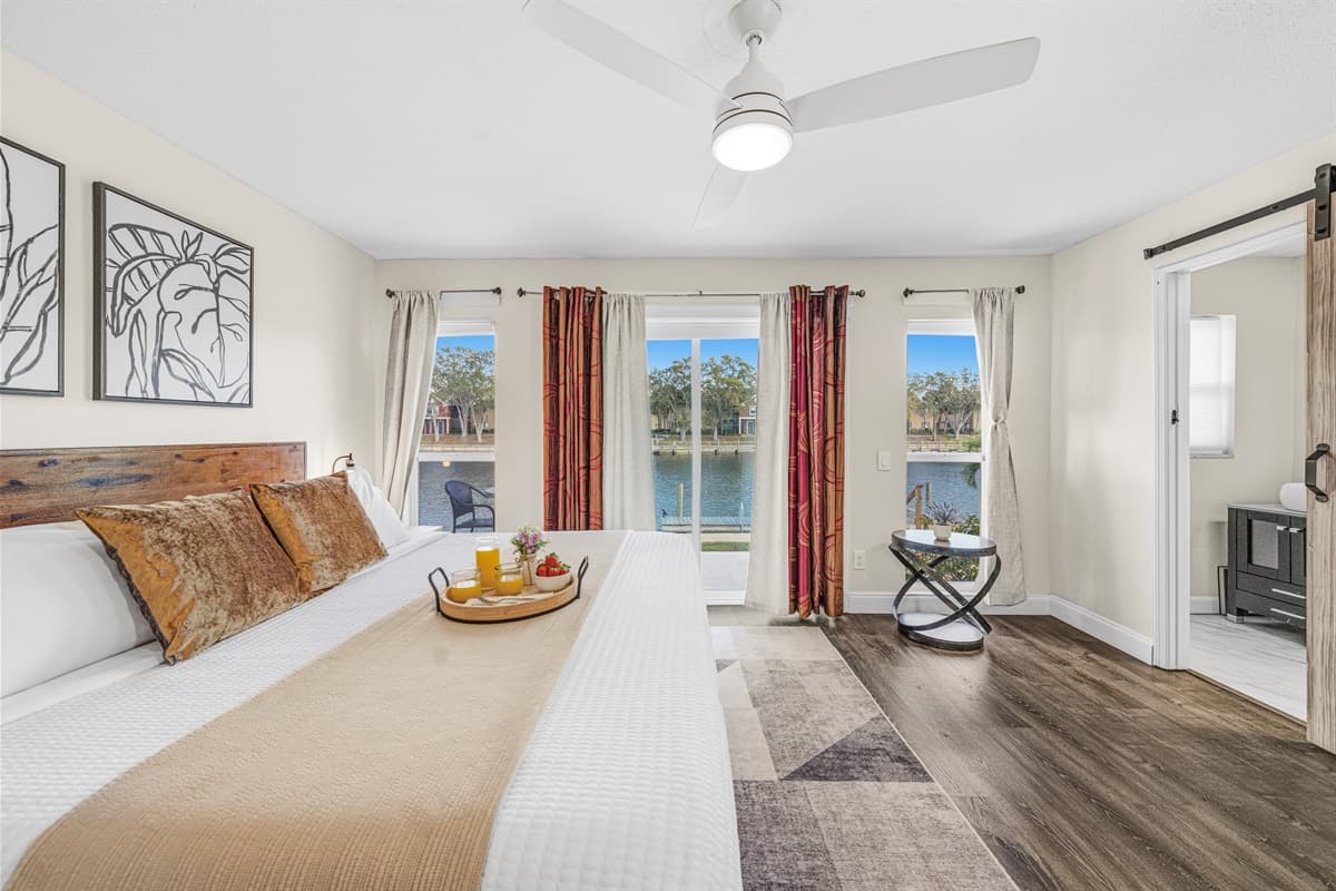 Wake up to tranquil water views from this spacious king bedroom.