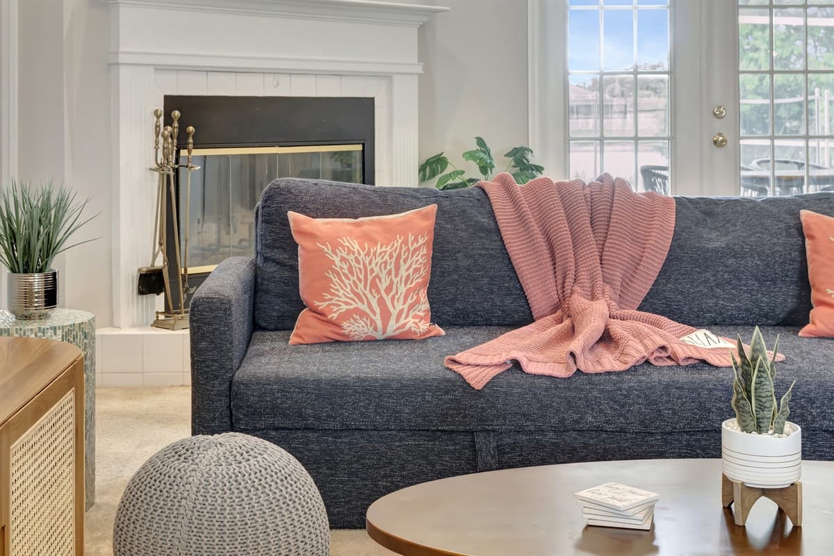 The room is thoughtfully designed with a harmonious blend of colors, textures, and decor.