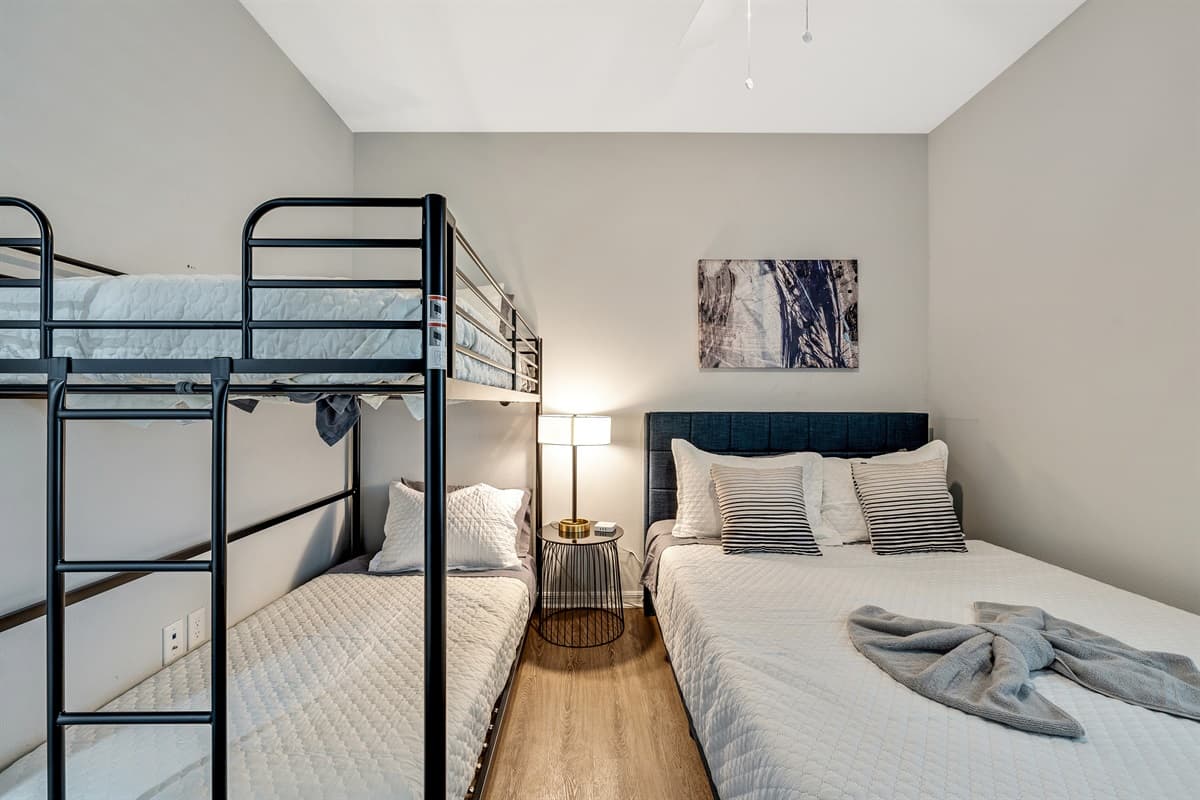 he queen-size bed provides a serene escape, while the bunk bed introduces an element of fun and flexibility for those with a penchant for unconventional sleeping arrangements.