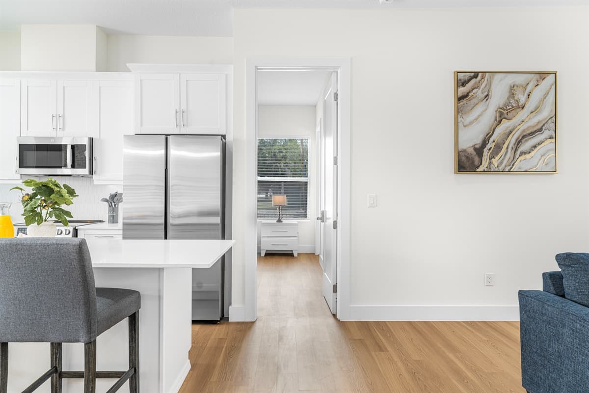 Kitchen with breakfast bar seating and easy access to adjacent living spaces.