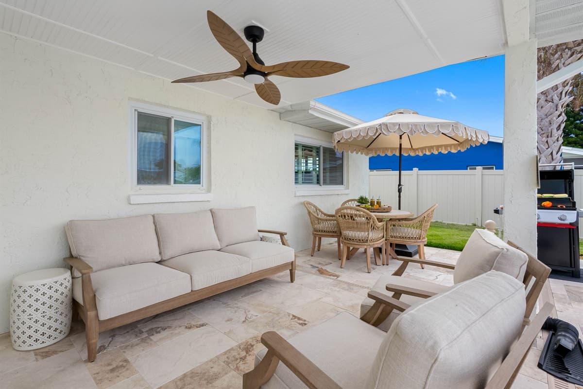 Enjoy shaded seating with ceiling fans to keep cool while overlooking the pool.