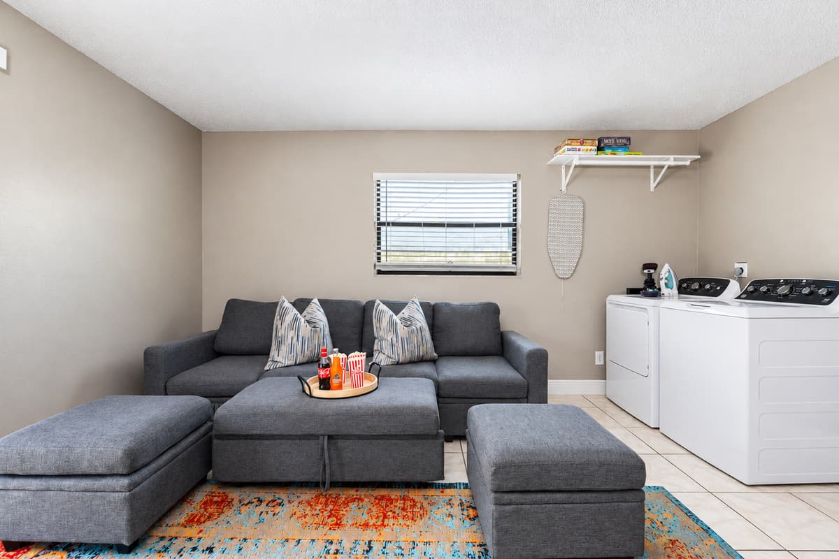 This flexible space is perfect for lounging, gaming, or getting a bit of work done. Enjoy the comfy sectional, retro arcade cabinet, and convenient in-unit washer and dryer.
