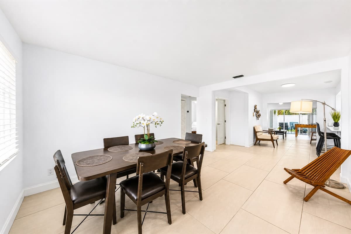 Open-concept dining area with modern décor and seamless flow into the main living spaces.