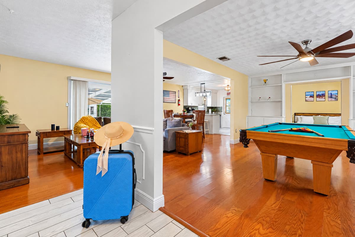 Enjoy friendly competition in this bright game room featuring a full-size pool table.